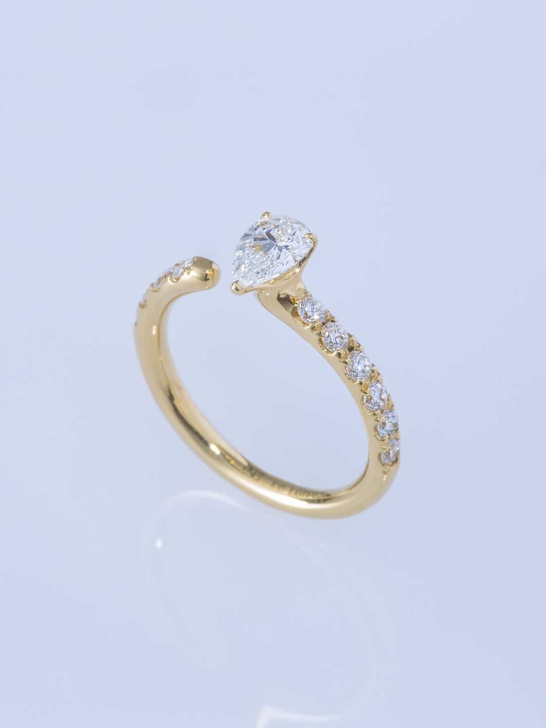 ONE K18YG PEAR 0.5CT HALF ETERNITY RING