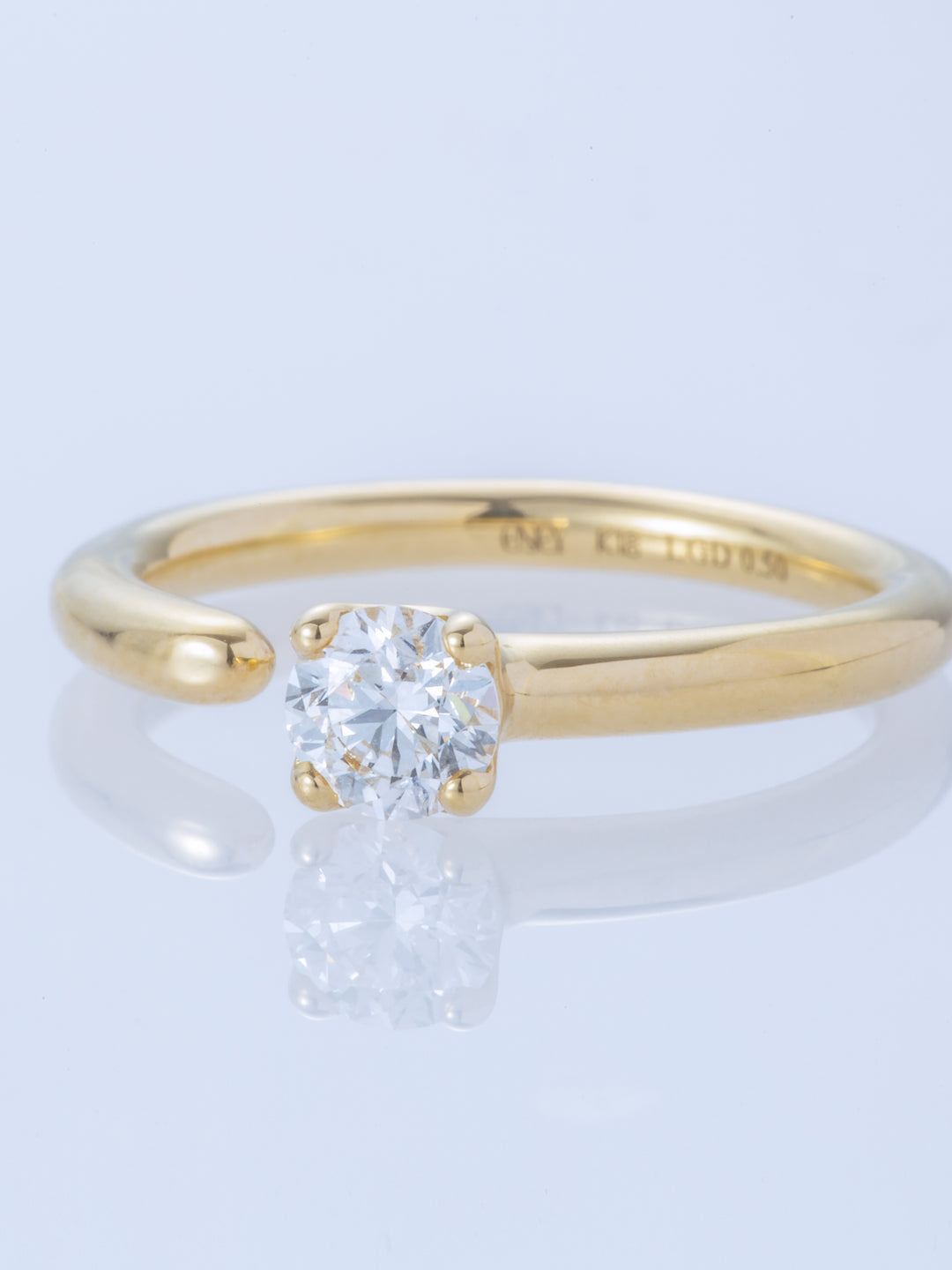 ONE K18YG 0.5CT ROUND RING