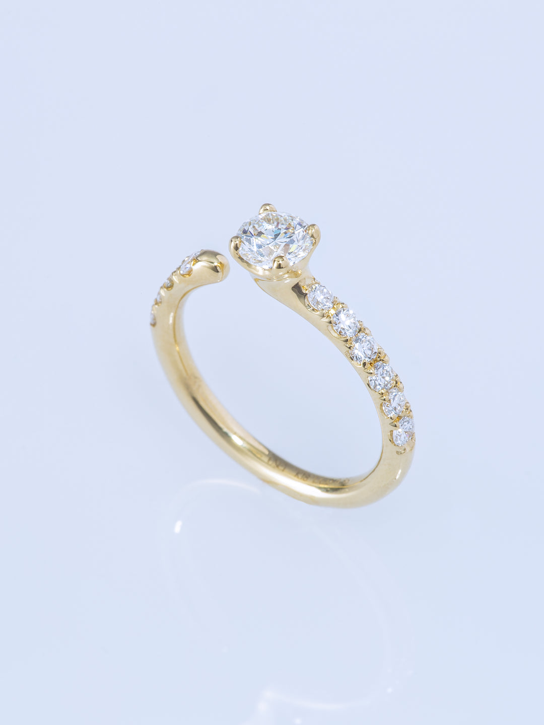 ONE K18YG ROUND 0.5CT HALF ETERNITY RING