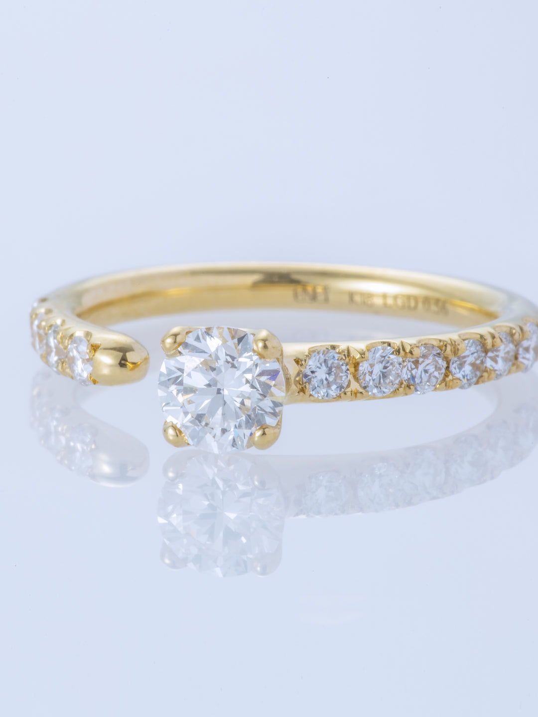ONE K18YG ROUND 0.5CT HALF ETERNITY RING