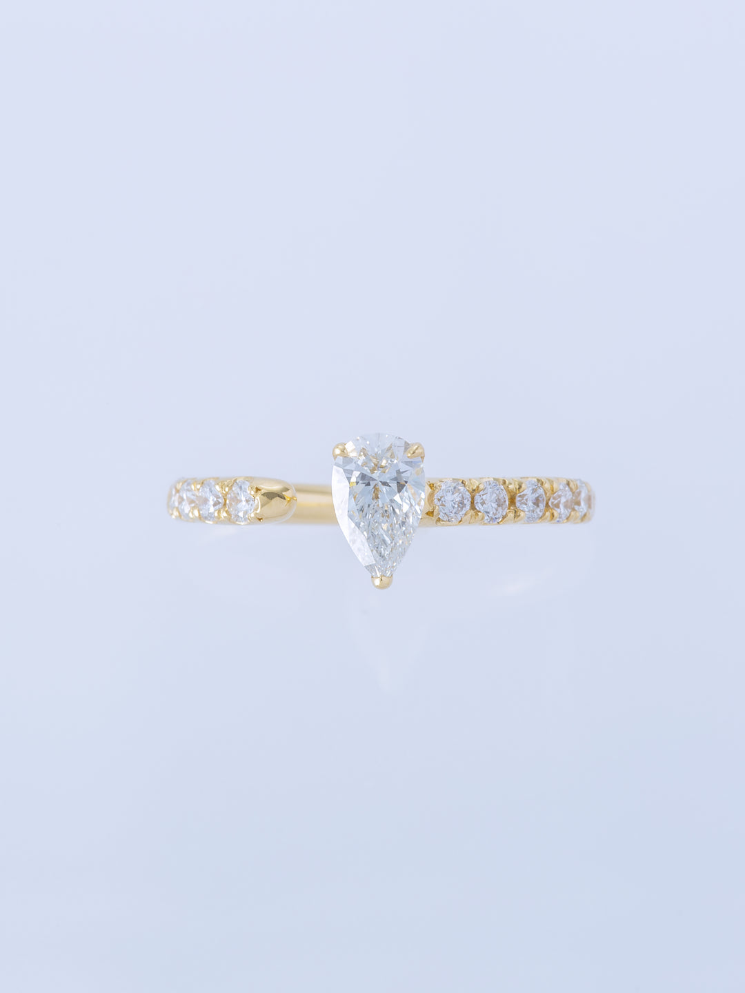 ONE K18YG PEAR 0.5CT HALF ETERNITY RING