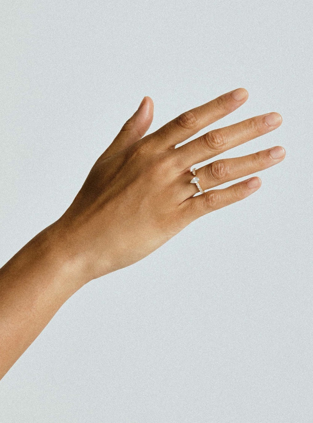 ONE K18YG PEAR 0.5CT HALF ETERNITY RING
